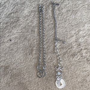 Set of two Guess necklaces.